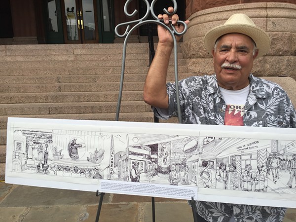 Joe Lopez stands beside his rendering of San Antonio's "the good old times." - Monica Simmons