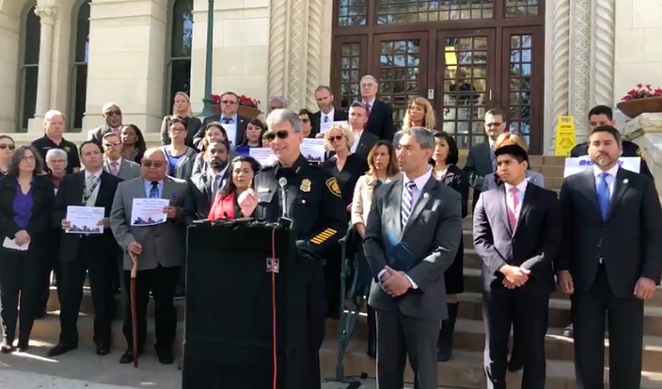 Chief McManus, flanked by San Antonio officials, at Thursday's press conference. - Alex Zielinski