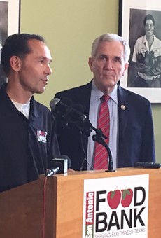 The S.A. Food Bank's Eric Cooper (left) and Rep. Lloyd Doggett discuss the farm bill's proposed cuts to food assistance.