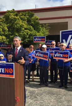 Mayor Ron Nirenberg speaks at the Go Vote No presser, surrounded by local Democrats.