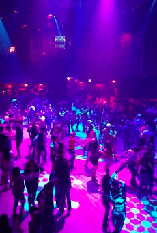 Revelers dance inside Cowboys Dancehall.