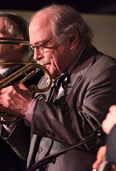 Jim Cullum playing trumpet during a gig
