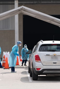 Cars pull up to the city's mobile coronavirus testing site at Freeman Coliseum.