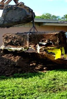 A coffin was found buried in a backyard on Elm St.