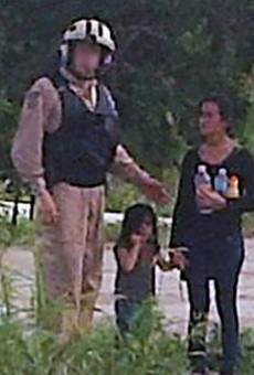 This 2014 photo shows a dehydrated teenage girl accompanied by a little girl who Border Patrol rescued in the Rio Grande Valley. Both were likely turned over to Immigration and Customs Enforcement.