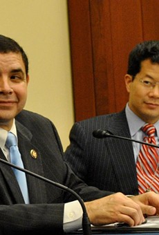 Rep. Henry Cuellar (left) announced more funding for immigration judges and support staff.
