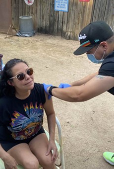 Mel Ramos gets vaccinated at The Friendly Spot’s ‘beer and a shot’ pop-up clinic.