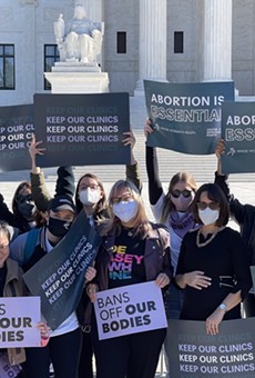 Abortion-rights advocates hold up signs in front of the U.S. Supreme Court last month.