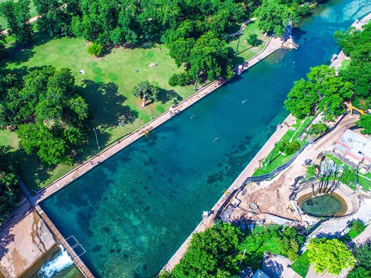 Barton Springs
2131 William Barton Drive, Austin, (512) 974-6300, austintexas.gov
Nestled in central Austin’s Zilker Park, the 68-to-70-degree spring water at Barton Springs makes for a great stop to cool off during a day of exploring the city. The 3-acre pool also serves as home for the endangered Barton Springs Salamander.