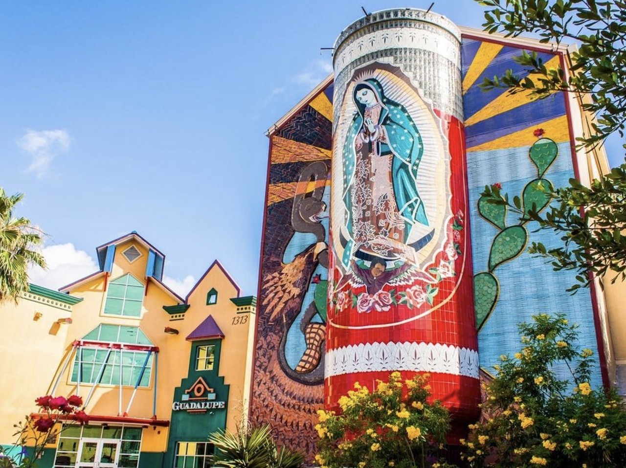 World's Largest Virgin Mary Mosaic
1315 Guadalupe St.
Jesse Treviño's spectacular mural La Veladora of Our Lady of Guadalupe features a 3D votive candle (veladora) with an eternal flame facing Guadalupe Street. Intended to serve as a beacon for the neighborhood, this mixed media mural is truly magnificent, and is even said to be the world's largest Virgin Mary mosaic.