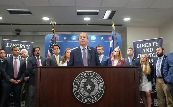 Ken Paxton and his top aides hold a press conference after the House voted to impeach him in May.