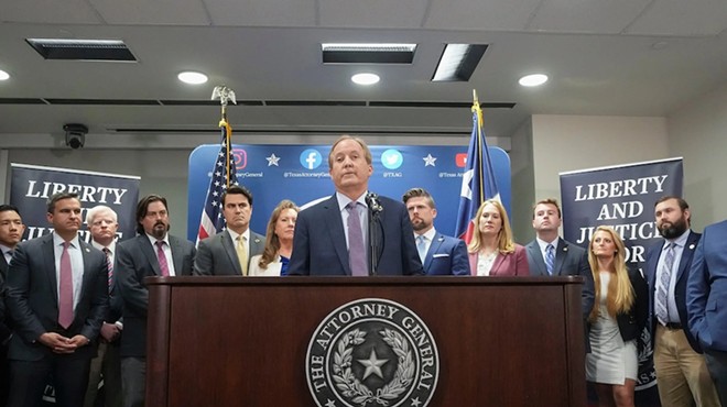 Ken Paxton and his top aides hold a press conference after the House voted to impeach him in May.