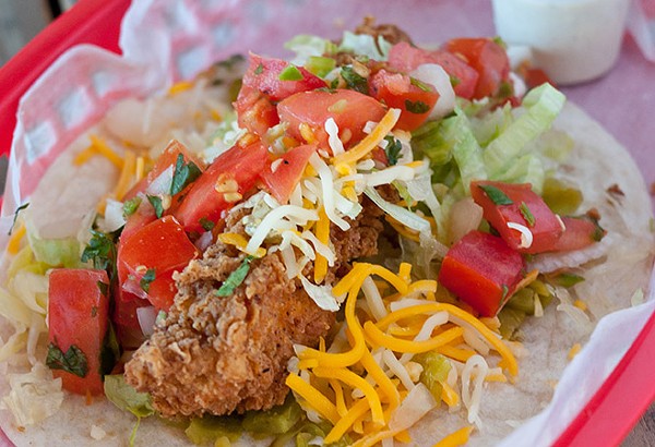 Torchy's Trailer Park taco with fried chicken, green chilies, lettuce, cheese, pico, poblano ranch - Courtesy