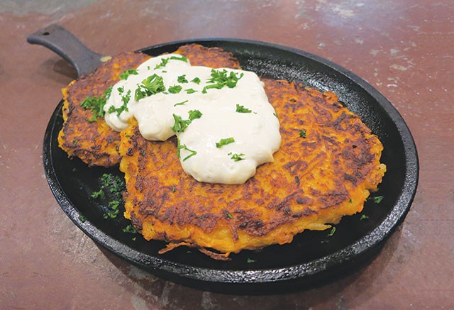 You can make traditional latkes at home or enjoy a sweet potato version from Green Vegetarian Restaurant (above) - MIRIAM SITZ