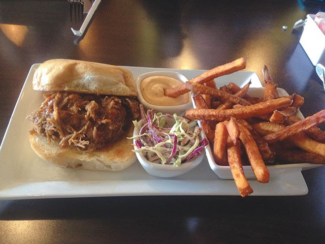 You’ll want extra napkins for the juicy pulled pork sandwich - LAUREN W. MADRID