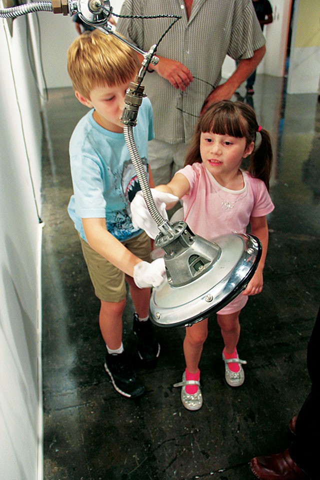Young visitors play at 'Interplay: Mechanical Objects.' - Courtesy photo